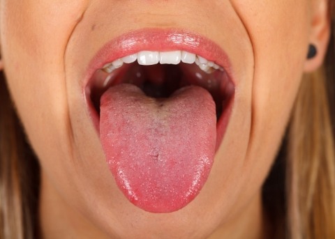 Close up of wide open mouth with tongue sticking out