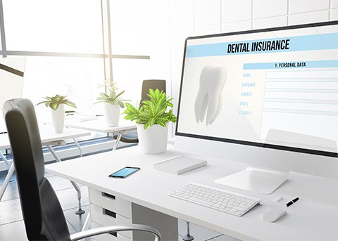 Dental insurance form on desktop in office